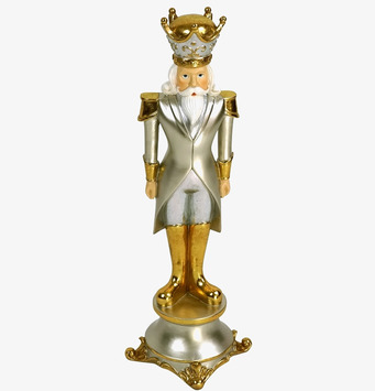 Foto av dekorativ nötknäppare i silver och guld