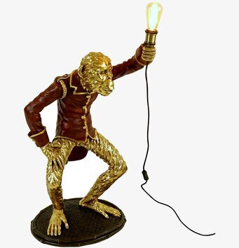 Bild av en unik golvlampa med kreativ design och guldtoner