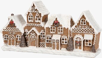 Bild av stämningsfull pepparkakshusdekoration med LED-ljus