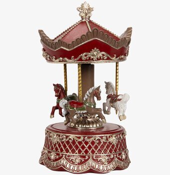 Bild av vacker röd speldosa karusell med gulddetaljer