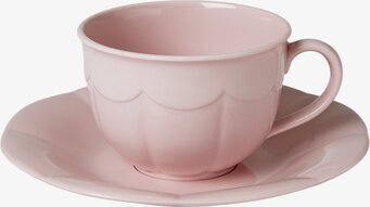 Bild av keramikset: kopp och fat i mild rosa nyans