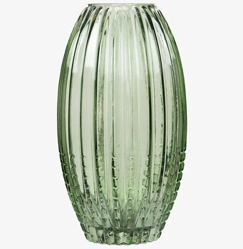 Bild av grön vas med modern design och texturerad yta