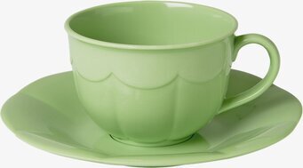 Bild av grön kopp och fat i plast med vågformad textur