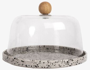 Bild av elegant ostkupa i glas med träknopp och stengodsbas