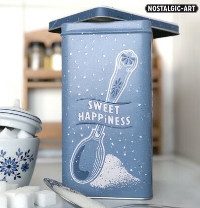 Bild av blå plåtburk med socker i hemtrevlig miljö