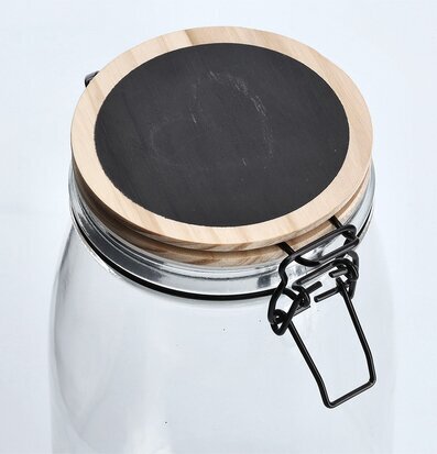 Bild av elegant glasburk med trälock och griffelyta