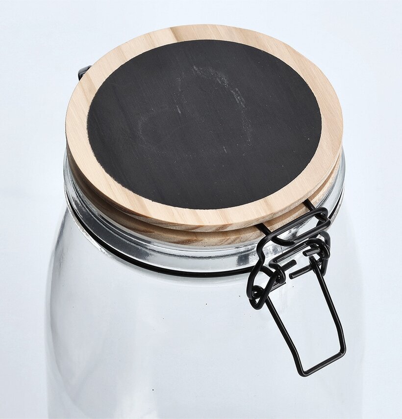 Bild av elegant glasburk med trälock och griffelyta