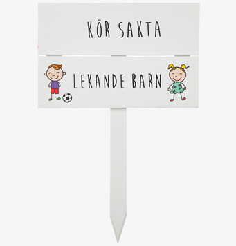 Bild av skylt med texten Kör sakta, Lekande barn
