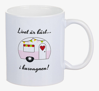 Bild av charmig porslinsmugg med husvagnsdesign