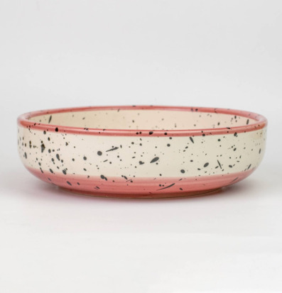 Bild av körsbärsrosa keramisk rivplatta med ombréeffekt