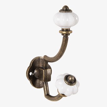 Bild av vintage krok i antik mässing med keramikdetaljer