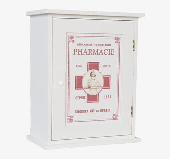 Foto av vintageinspirerat medicinskåp med röd korssymbol