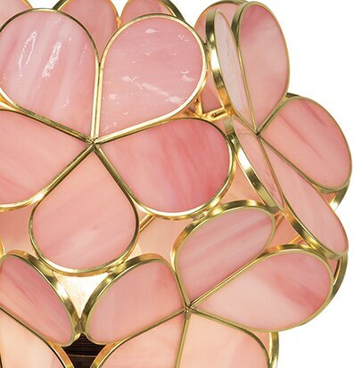 Foto av elegant bordslampa med rosa glas och gulddetaljer