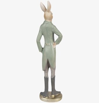 Bild av en elegant kaninfigur i beige och grön klädsel