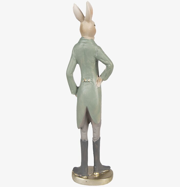 Bild av en elegant kaninfigur i beige och grön klädsel
