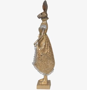 Bild av dekorativ guldkanin i elegant, detaljrik dräkt