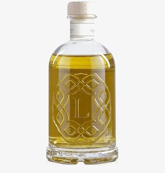 Bild av elegant flaska med doftpinnar i klart glas