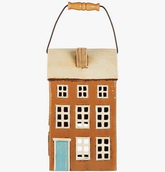 Bild av ljuslykta formad som nostalgiskt litet hus