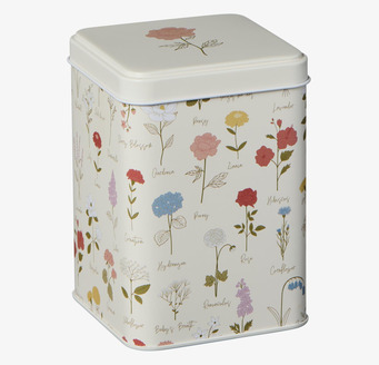 Bild av fyrkantig plåtburk med blommönster och lock
