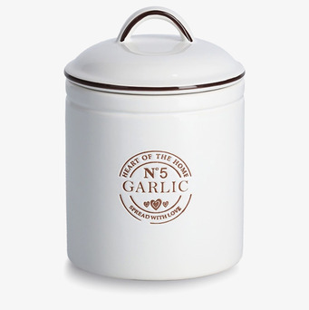 Bild av stilren vitlöksburk med dekorativ etikett