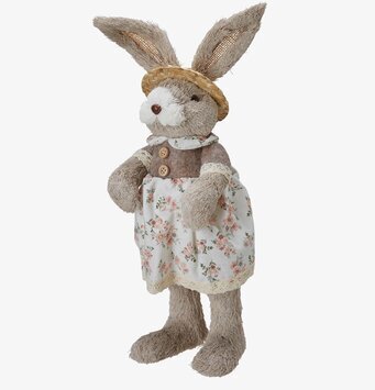 Bild av charmig påskhare i blommig klänning och halmhatt