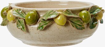 Bild av keramikskål med dekorativa frukter och blad