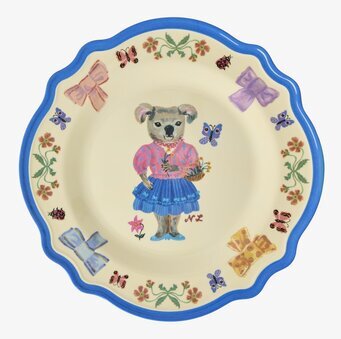 Bild av färgglad tallrik med koalamotiv och blommor