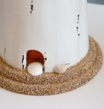 Bild av fyrtornslampa med maritim och kustnära design