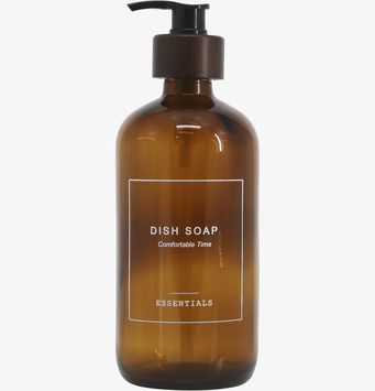 Bild av glasflaska med pump för diskmedel i köket