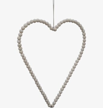 Bild av dekorativ hjärtformad prydnad med vita pärlor