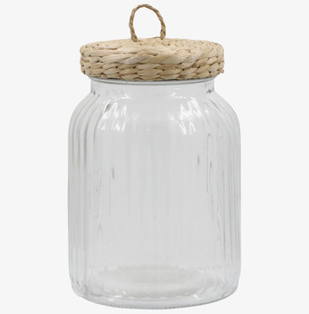 Bild av glasburk med flätat lock och vågig struktur