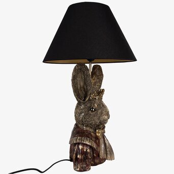 Bild av antik bordslampa med kanin och kunglig design