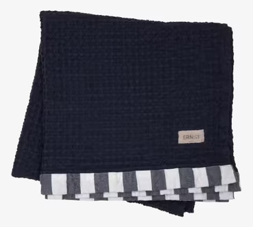 Bild av stilrent blått våfflat badlakan med struktur