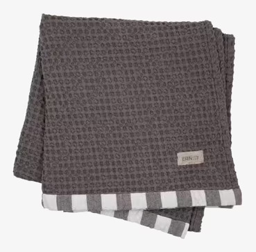 Bild av grått badlakan med våfflad struktur och ränder