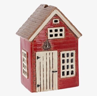 Bild av charmerande ljuslykta formad som ett litet hus