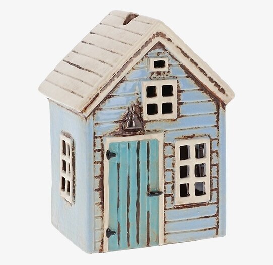 Bild av ljuslykta i form av ett charmigt litet hus