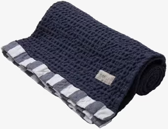 Bild av våfflad blå handduk med djup och elegans