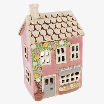 Bild av detaljrik ljuslykta som föreställer blomsterbutik