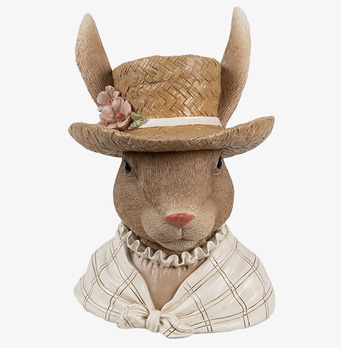 Bild av charmig kaninfigur med hatt och blommor