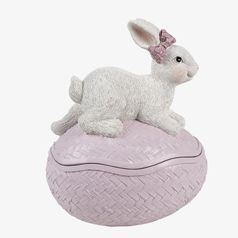 Bild av dekorativt rosa påskägg med kanin och rosett