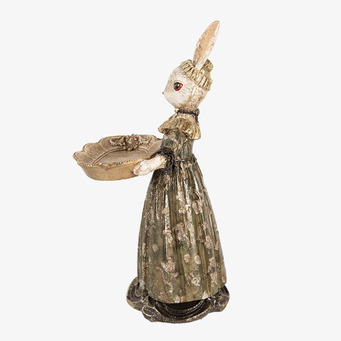 Bild av dekorativ kaninfigur i beige och guldtoner