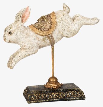 Bild av dekorativ kaninfigur på stativ i antik stil