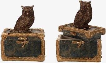 Bild av dekorativt skrin med uggla och gulddetaljer