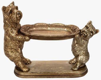 Bild av gyllene terrierkonstverk med dekorativt fat