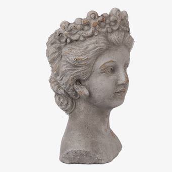 Bild av skulptur: Kvinnas huvud med blommor i håret