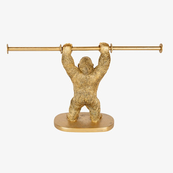 Bild av en gyllene gorilla pappershållare i unik design