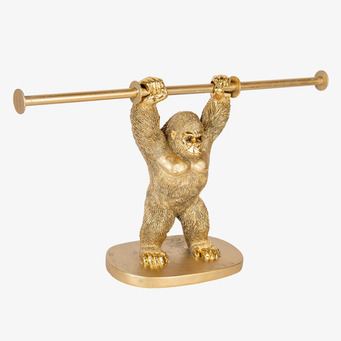 Bild av gyllene gorillaskulptur som pappershållare