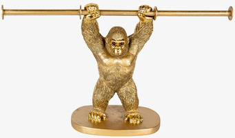 Bild av gyllene gorillaformad pappershållare