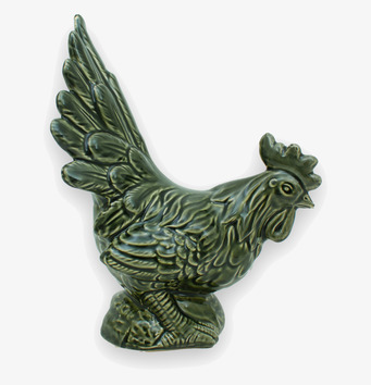 Bild av dekorativ grön tuppfigur med detaljerat hantverk
