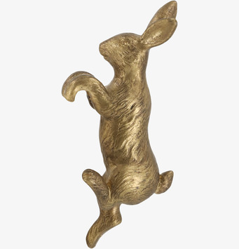 Bild av klättrande kaninskulptur i elegant mässing